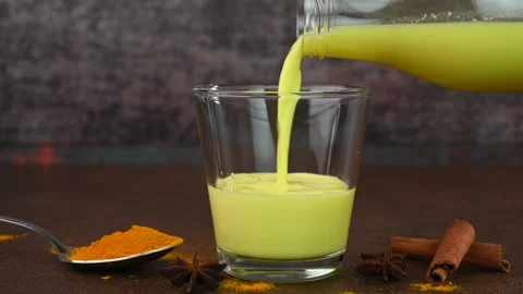 Serving turmeric milk Stock Footage 308315056