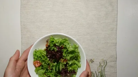 Serving vegetarian salad on a table top view Stock Footage 103108757