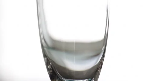 Serving water in a glass with white background Stock-Footage 67729791