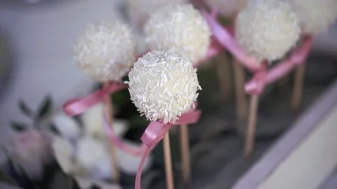 Serving of wedding table. Candy coconut flakes on a skewer at the wedding table 스톡 동영상 70754499