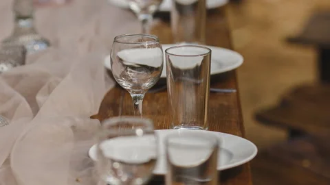 Serving of a wooden table. Wedding decorations. Banquet at the open area. Stock Footage 86367830