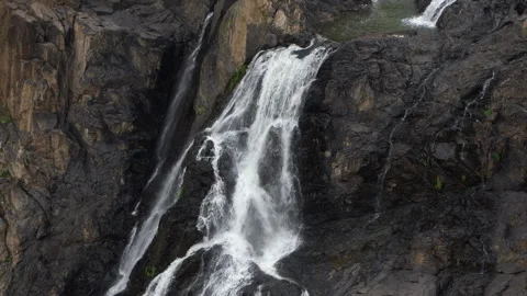 Servo Slow Zoom Out from Large Waterfall in Natural Landscape Stock Footage 314949054