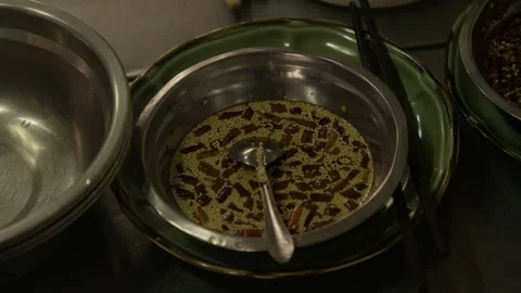 Sesame and Sliced Ingredient Mixture in Metal Bowl on Beijing Street Food Stock Footage 345883028
