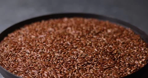 Sesame seeds rotating macro loop video with tilt shift focus Video stock 320979250