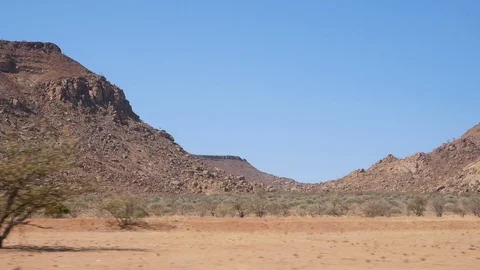 Sesfontein camera car, dry landscape, mountains, Namibia, Africa in HD Stock Footage 90923550