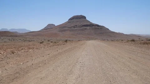 Sesfontein camera car, dry landscape, mountains, Namibia, Africa in HD Stock Footage 90923946