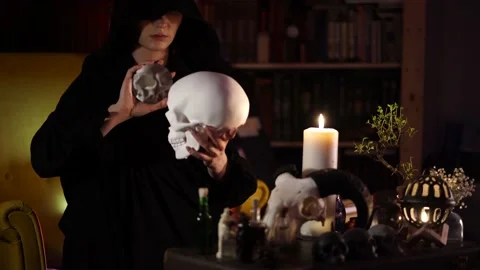 Session of black magic with human skull and mirror Stock-Footage 133078374
