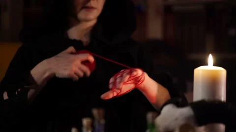 Session of black magic with a red thread 스톡 동영상 133078131