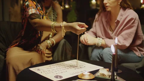 Session with Pendulum over Letters, Seer Communicating with Spirits Stock Footage 247629792