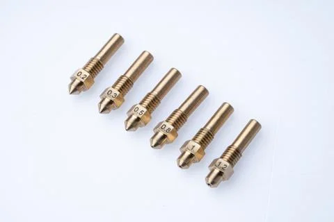 Set of 3D printer nozzles in different sizes on a white background Stock Photos