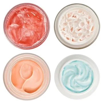 Set of 4 different dermal creams and gels isolated on white Foto stock