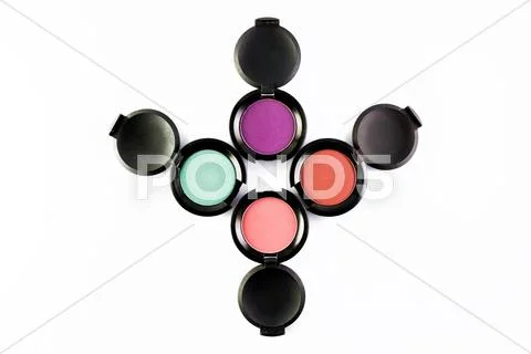 Set of 4 Make-up colourful eye shadows isolated on a white background. Stock Photos