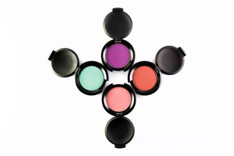 Set of 4 Make-up colourful eye shadows isolated on a white background. Фото