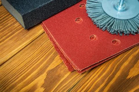 Set of abrasive tools and brown sandpaper on vintage wooden boards wizard is Stock Photos
