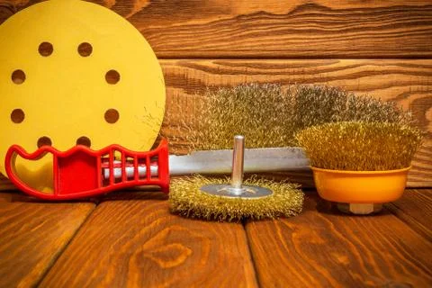 Set of abrasive tools and sandpaper on vintage wooden boards Stock Photos