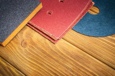 Set of abrasive tools and a sandpaper on vintage wooden boards, wizard is use Stock Photos