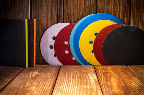 Set of abrasive tools for grinding on the background of old wood. Stock Photos