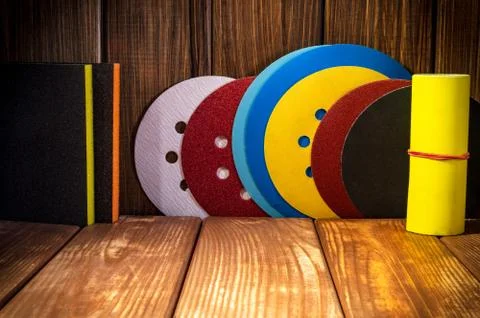 Set of abrasive tools for grinding on the background of old wood. Stock Photos