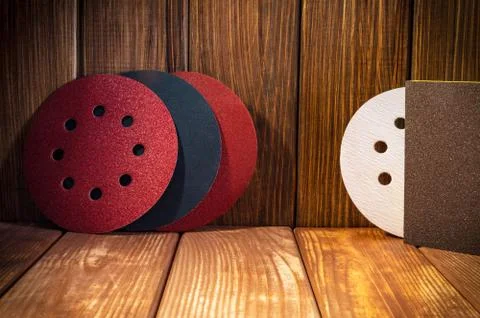 Set of abrasive tools for grinding on the background of old wood. Stock Photos