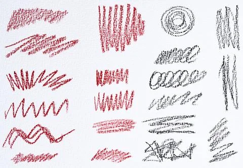 A set of abstract strokes and doodles drawn in red and black pencil. Variou.. イラスト素材