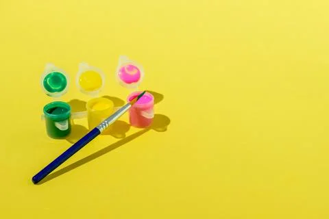 Set of acrylic paint with brush Stock Photos