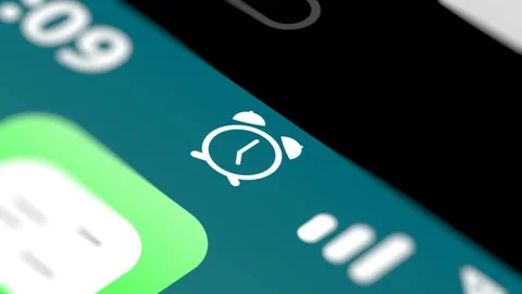 Set an Alarm Icon on Smartphone Screen Stock Footage 123815909