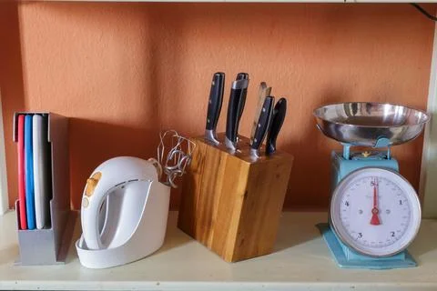 Set of appliances and objects used in kitchen on wooden table Stock Photos