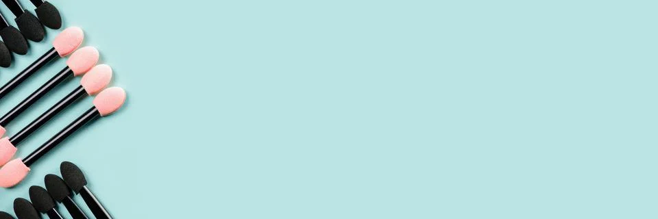 Set of applicators for shadows on blue background. Banner. Stock Photos