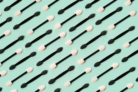 Set of applicators for shadows on green background. Stock Photos