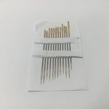Set of Assorted Hand Sewing Needles in Paper Packaging Stock Photos