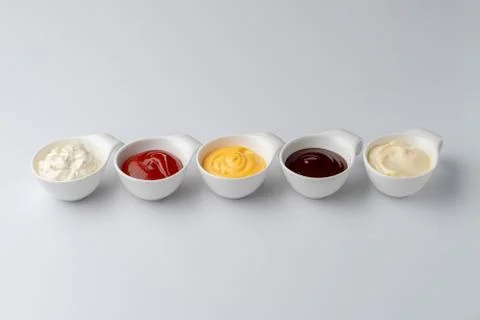 Set of assorted snack sauces isolated on white background: sour cream, mayo,  Stock Photos