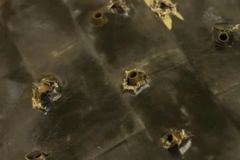 Set of automaton shells stuck in a hard surface body armor body protection Stock Photos