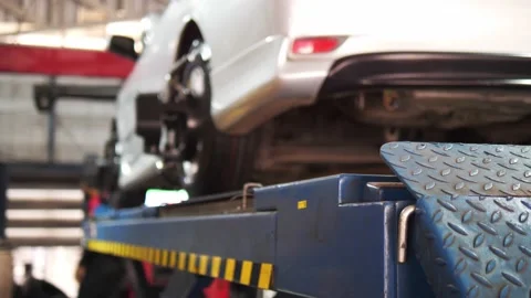 Set up a balancing center. Process of balancing and fitting car tire wheel .. Stock Footage 238880545