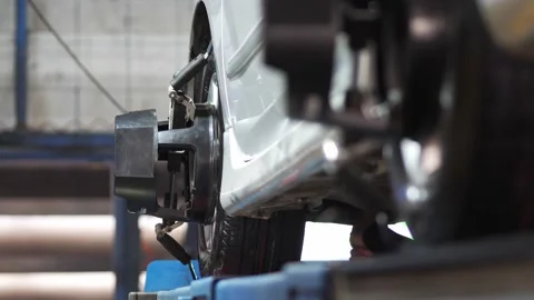 Set up a balancing center. Process of balancing and fitting car tire wheel .. Stock Footage 238880558