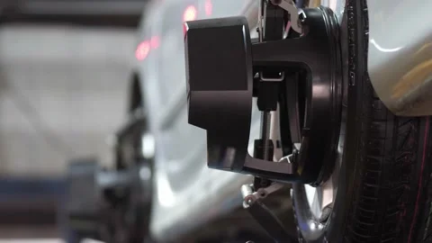 Set up a balancing center. Process of balancing and fitting car tire wheel .. Stock Footage 238880559