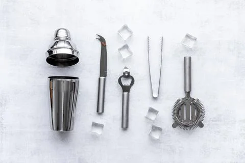 Set of bartender tools and accessories with a cocktail shaker Stock Photos