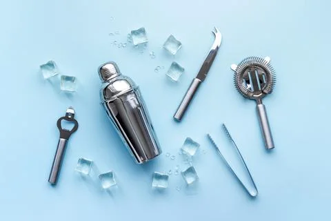 Set of bartender tools and accessories with a cocktail shaker Stock Photos