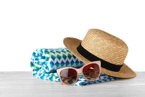 Set of beach accessories on table against white background. Space for text Stock Photos