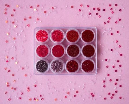 Set of beads on a pink background. Stock Photos