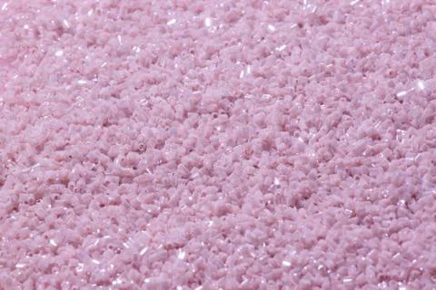 Set of beads on a pink background. Stock Photos