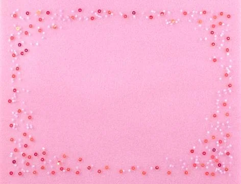 Set of beads on a pink background. Foto stock