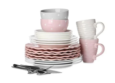 Set of beautiful ceramic dishware and cutlery isolated on white Stock Photos