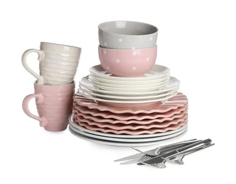 Set of beautiful ceramic dishware and cutlery isolated on white Stock Photos
