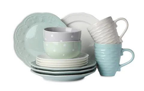 Set of beautiful ceramic dishware isolated on white Stock Photos