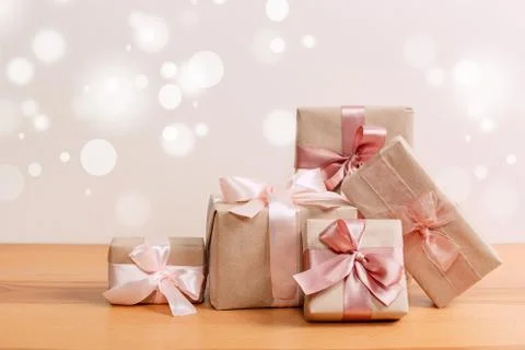 Set of beautiful different gift boxes made by handmade with pink bows on a wo Stock Photos