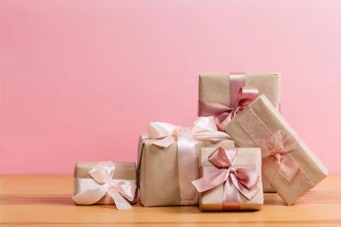 Set of beautiful different gift boxes made by handmade with pink bows on a wo Stock Photos