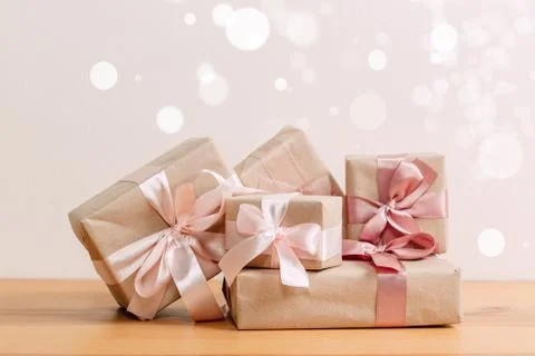 Set of beautiful different gift boxes made by handmade with pink bows on a wo Stock Photos