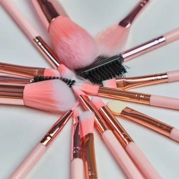 Set of beautiful different soft pink brushes for make up Stock Photos