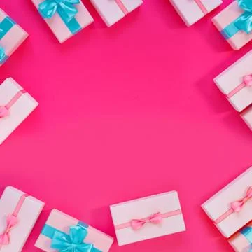 Set of beautiful gift boxes with blue bows on pink background. Holiday sale. Stock Photos