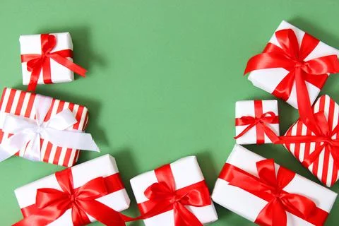Set of beautifully wrapped gift boxes on a colored background top view. 写真素材